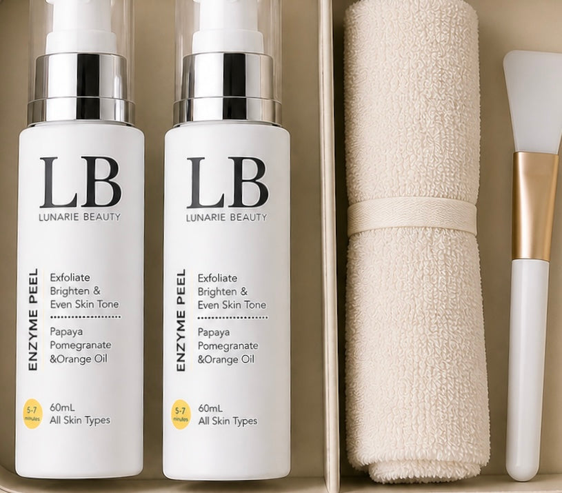 Two bottles of Lunarie Beauty Enzyme Peel with a towel and brush on a beige background