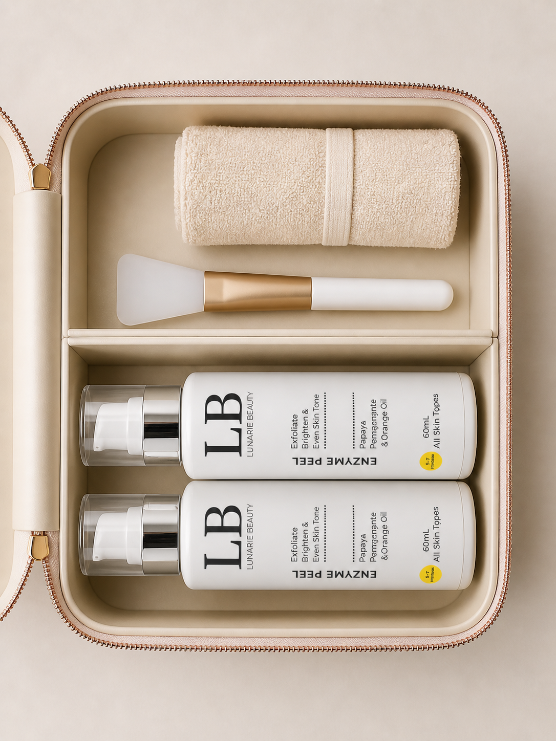 Enzyme peel Skincare product set with bottles, a towel, and brush in an open beige case.