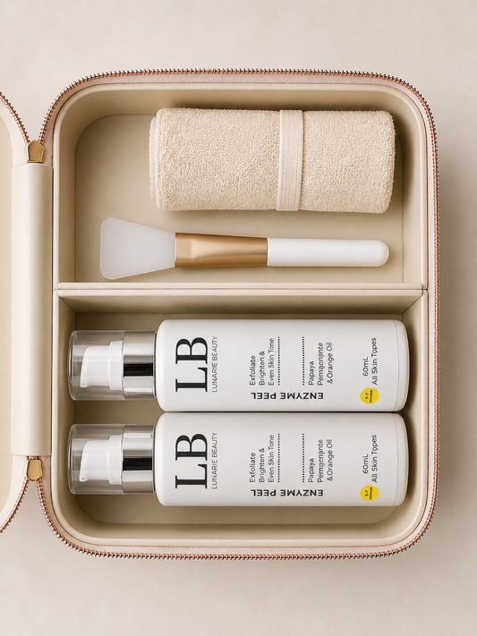Enzyme peel Skincare product set with bottles, a towel, and brush in an open beige case.