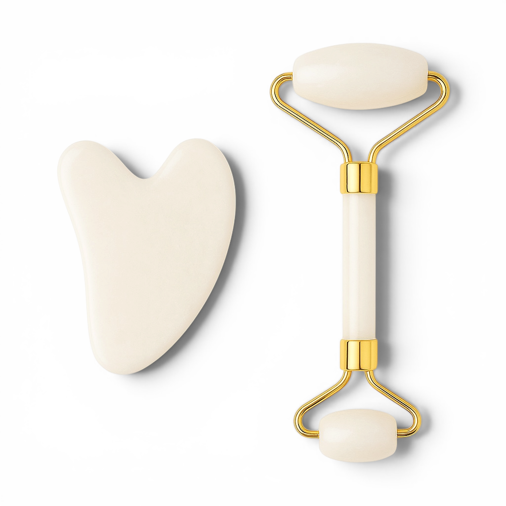 White facial roller and heart-shaped tool on a white background