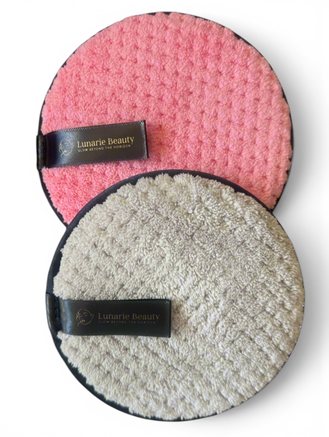 Two round cleaning pads, one pink and one gray, with 'Lunarie Beauty' branding on a gray background.